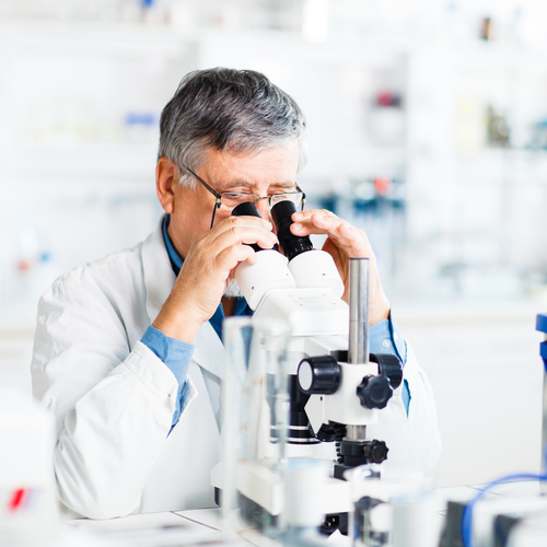 Scientist using a microscope